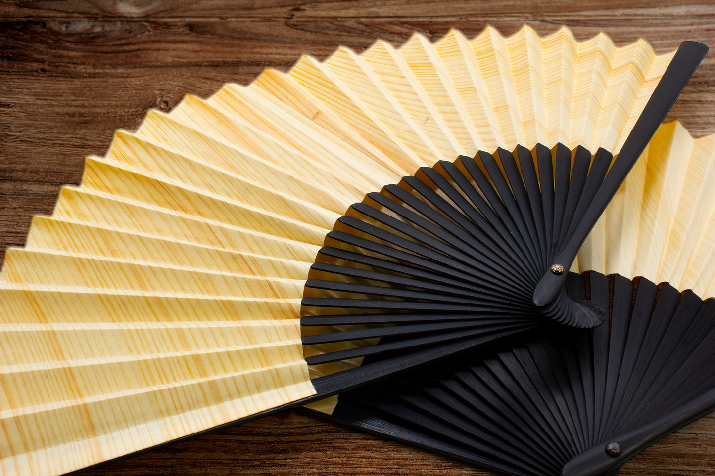 Natural wood folding fan